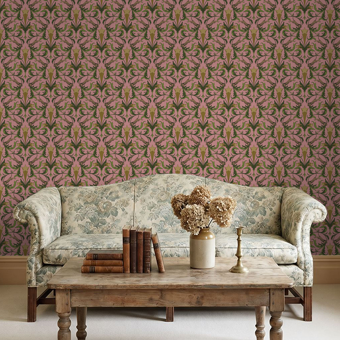 Hollywood Regency Blush wallpaper with leopards and foliage in a vintage living room setting.