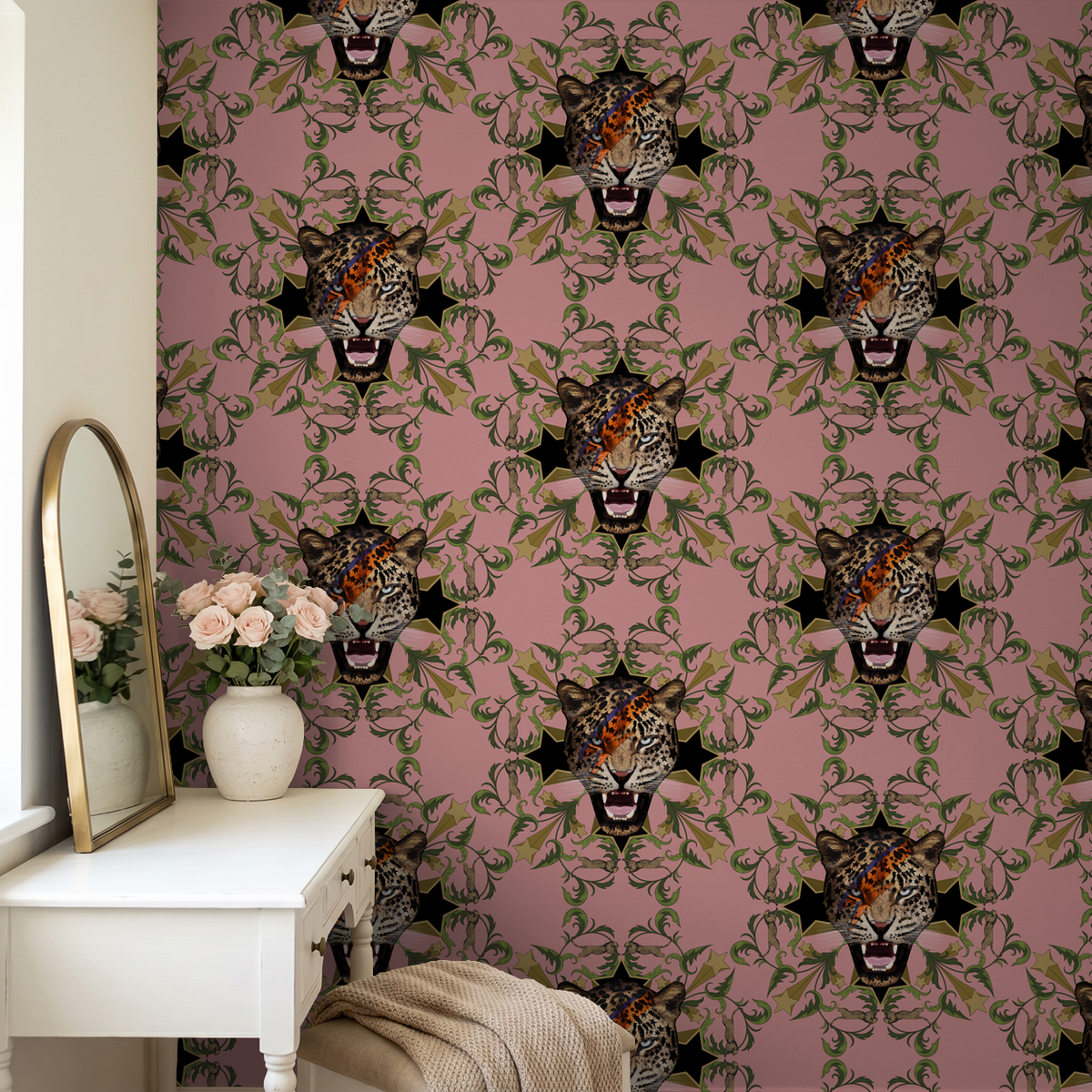 Leopard face wallpaper with green leaves on pink in a stylish room.
