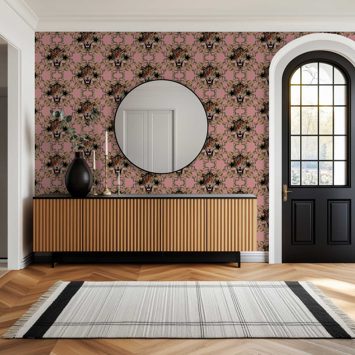 Starlight Leopard Blush wallpaper with leopard faces, green leaves, and stars on pink in a modern room.