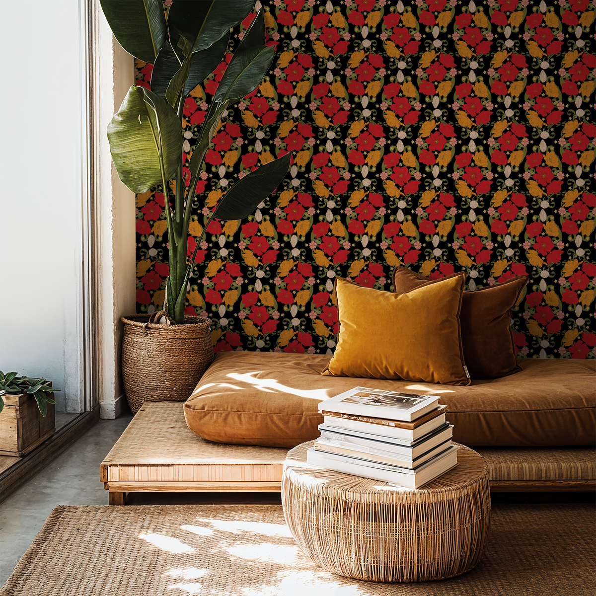 Bloom Noir wallpaper with bold red and orange florals on black in a cozy living room.