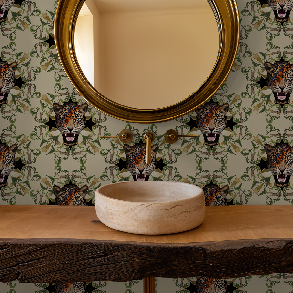Leopard motif wallpaper with green foliage in bathroom with round mirror and wooden sink.