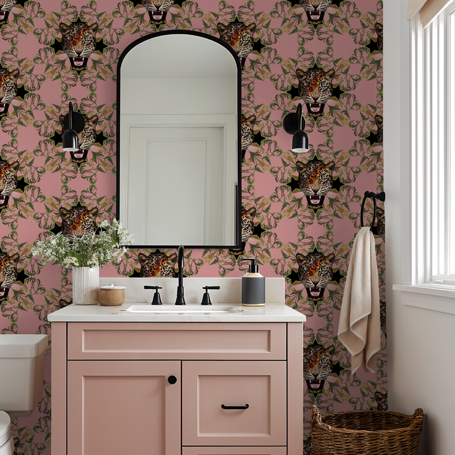 Bold leopard face wallpaper with pink, green leaves, and golden stars in a modern bathroom.