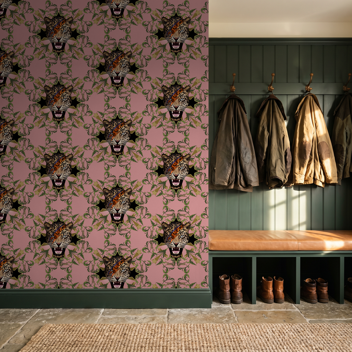 Bold leopard face wallpaper with green leaves on pink background in entryway.