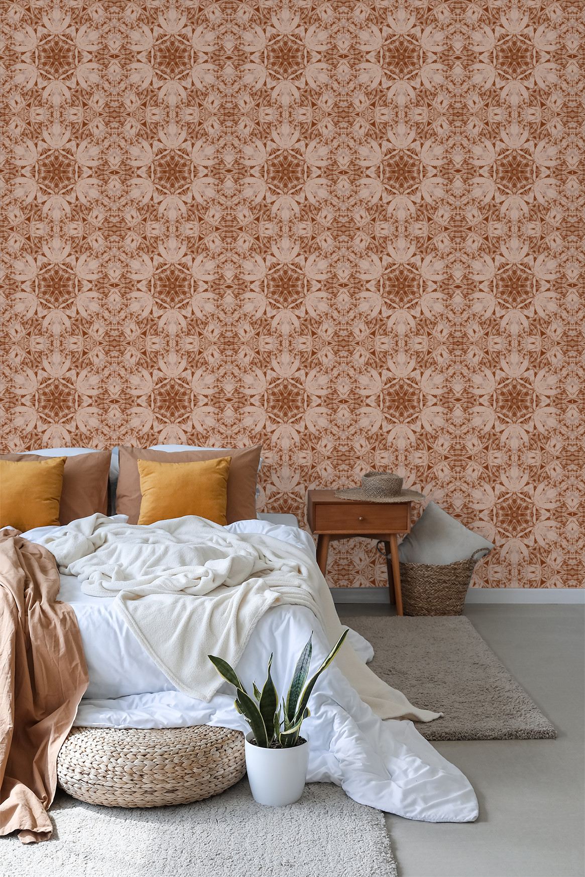 Terracotta and cream kaleidoscopic wallpaper in cozy bedroom setting.